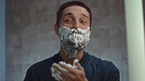 Man with foam for shaving on head Video stock 107323364