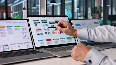 Man Focused On Computer Screen Developing User-friendly App Stock Footage 335458322