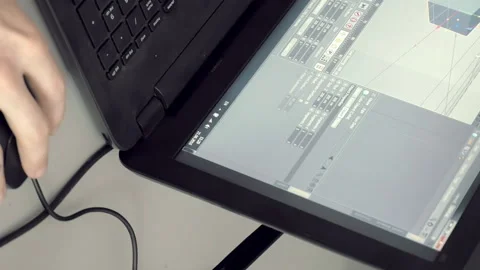 Man is focused on explaining his work on laptop Stock Footage 90422636