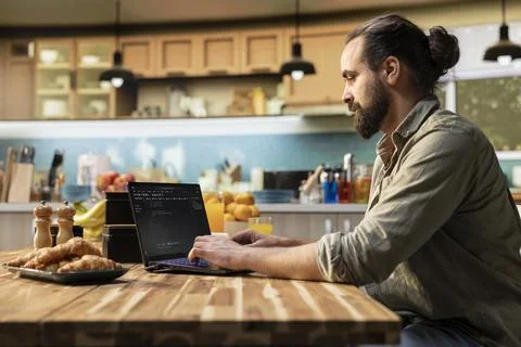 Man focused on programming and software development tasks 스톡 사진