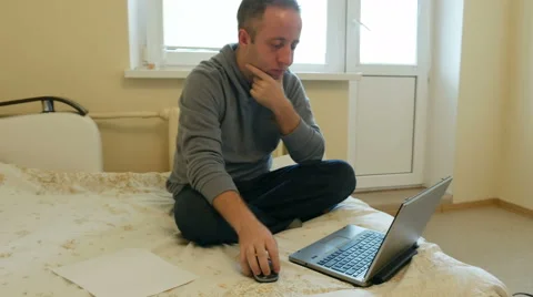 Man focused on work or social media on his laptop Stock Footage 62225049