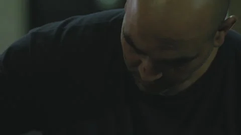 Man focuses on his work looking down Stock Footage 275072828