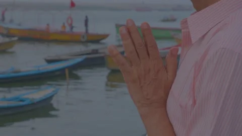 Man folded hand front of ganges river at sun rise time in varanasi ghats 스톡 동영상 220765778