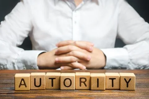 The man folded his hands in the lock and the word Authority. Respected, hon.. Stock Photos