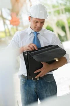 Man with folder looking for documents Stock Photos