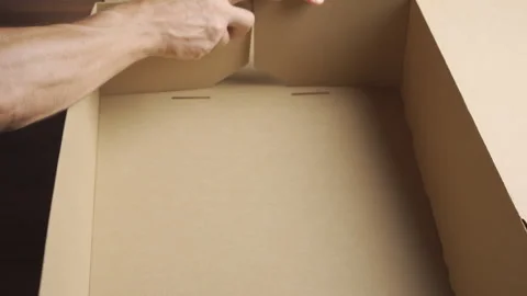 Man folding cardboard box for packing goods. Hands close-up Stock Footage 282201792