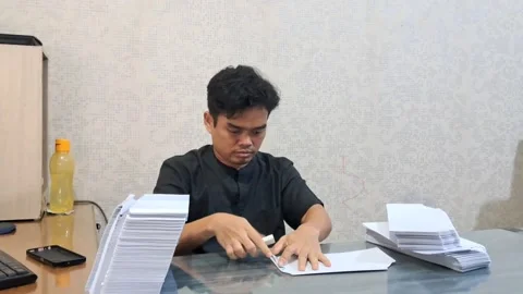 Man folding paper Stock Footage 330056797