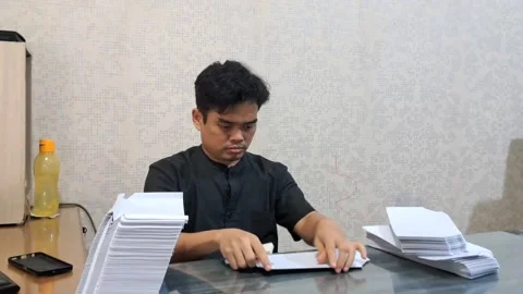 Man folding paper Stock Footage 330056800