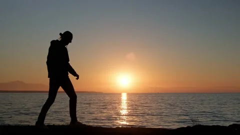 Man fooling around against sunset. Stock Footage 170195583