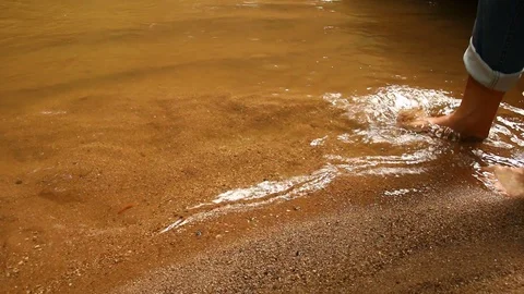 Man foot walking in the stream Stock Footage 95460877