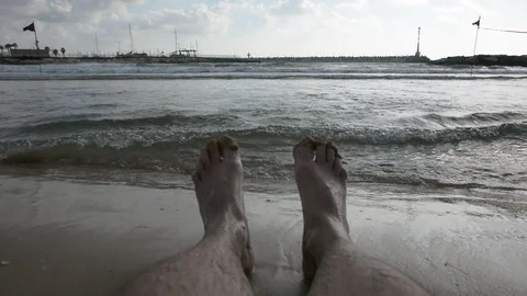 Man foots with Sea Waves over Sand Beach Background 스톡 동영상 92575337