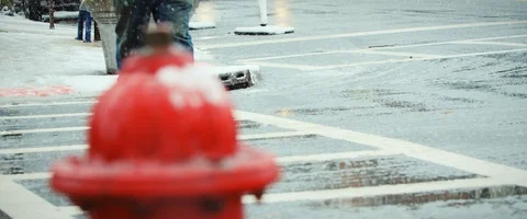 Man footsteps walking in Heavy Snow with fire hydrant in front Stock Footage 121493345