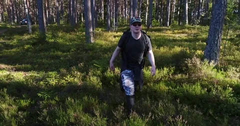 Man in the forest, Cinema 4k view of a hiker, walking towards the camera, in  Stock Footage 82591454