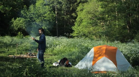 The man in the forest has lost the connection to the phone. White man can not Stock Footage 64309291