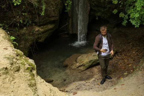 A man in the forest with a phone Stock Photos