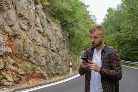 A man in the forest with a phone Stock Photos