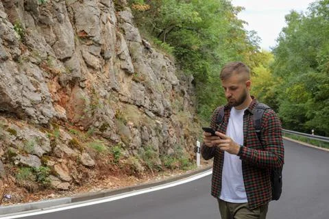 A man in the forest with a phone Stock Photos