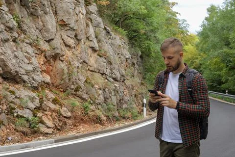 A man in the forest with a phone Stock Photos