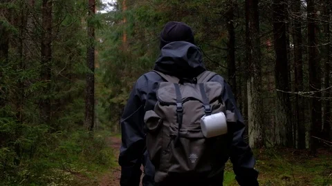 Man in forest trail with backpack, gimbal shot Stock Footage 97505107
