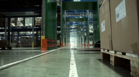 Man on forklift transporting cargo from one storage to another Stock Footage 67336451