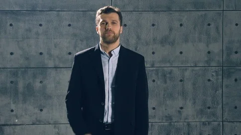 Man in formal suit catches bundle of money Stock Footage 83386901