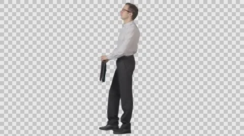 Man in formal wear with document case stands. Side view. Green screen footage Stock Footage 58580278