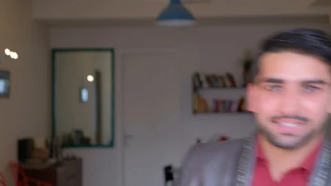 Man in formals looks scared and afraid of the camera pov and raises both his han Stock Footage 101286552