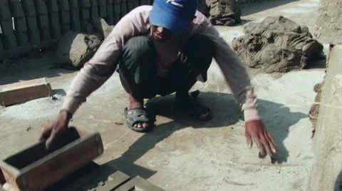 Man forms bricks from clay at the factory in Dhaka, Bangladesh. Stock Footage 48322429
