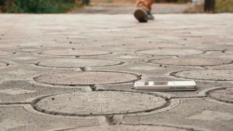 Man found a smartphone on the sidewalk Stock Footage 95806201