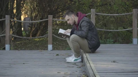 The man found something interesting in a notebook and was delighted 스톡 동영상 162762919