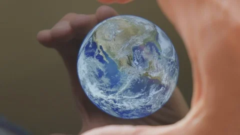 A man framing the earth in his hands Video stock 102967511
