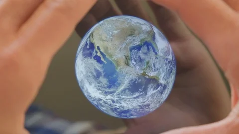 A man framing the earth in his hands Video stock 102968868
