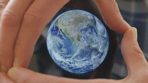 A man framing the earth in his hands Video stock 102970982