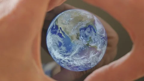 A man framing the earth in his hands Video stock 102974671