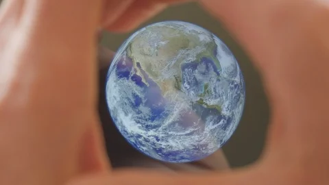 A man framing the earth in his hands Video stock 102975906
