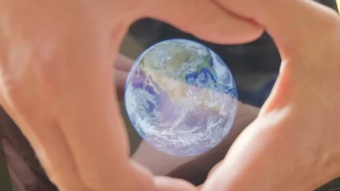 A man framing the earth in his hands Video stock 102984816