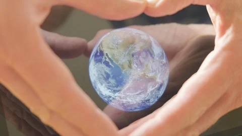 A man framing the earth in his hands Video stock 102989749