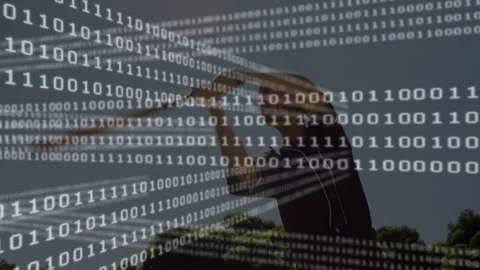 Man framing sky outdoors, showcasing cascading binary code overlay for Stock Footage 307550797