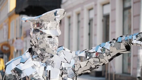 Man in freaky sparkling silver suit with hat and mask moves Stock Footage 108572297