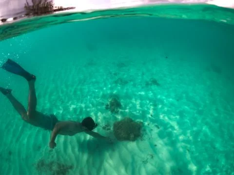 Man Free Diving and Exploring the waters of Grand Cayman Stock Photos