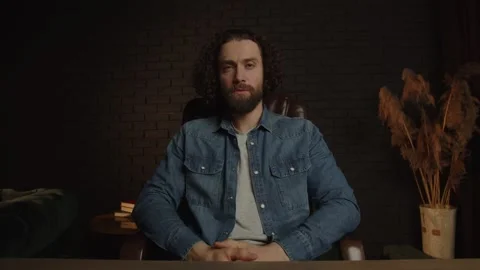 Man freelancer with a beard at the workplace in the office is unhappy, Lonely Stock Footage 250020310