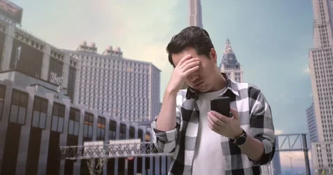 Man Freelancer Looking At Smartphone And Shaking His Head Having A Headache Stock Footage 245288125
