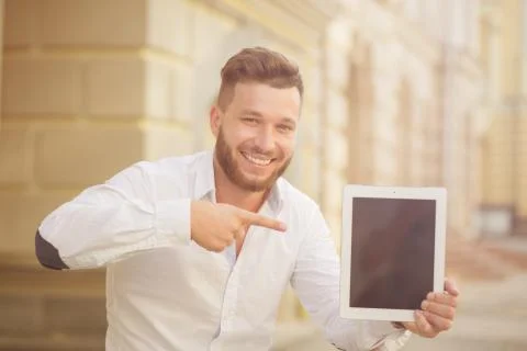 Man freelancer with tablet PC Stock Photos