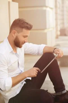 Man freelancer with tablet PC Stock Photos
