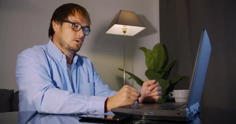 Man freelancer using laptop working from home in internet. Stock Footage 123406247