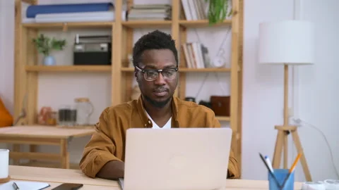 Man freelancer work type text at laptop in home office Spbas. 20s business owner Stock Footage 149824175