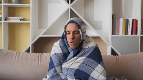 Man freezing feeling cold at home, ill sick man  Stock Footage 134872267