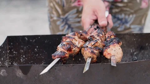 The man fries a kebab. Stock Footage 95044392