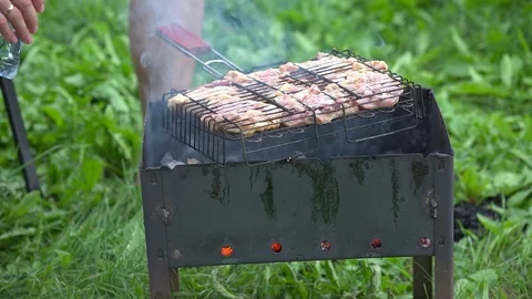 Man fries kebabs Stock Footage 114031612