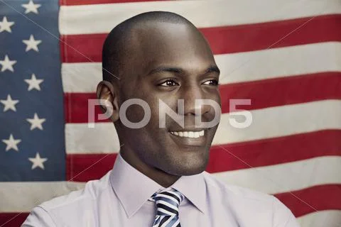 Man in front of American flag Stock Photos